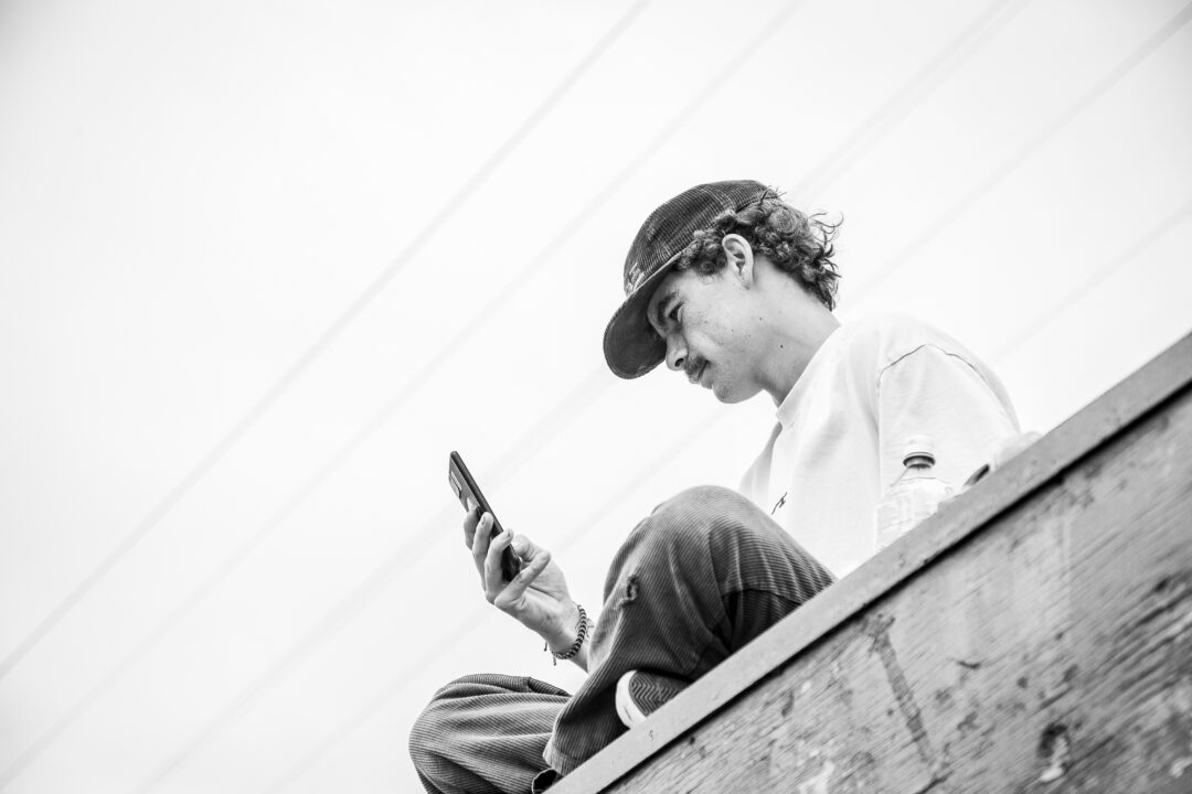 Absorbed in skateboarding.