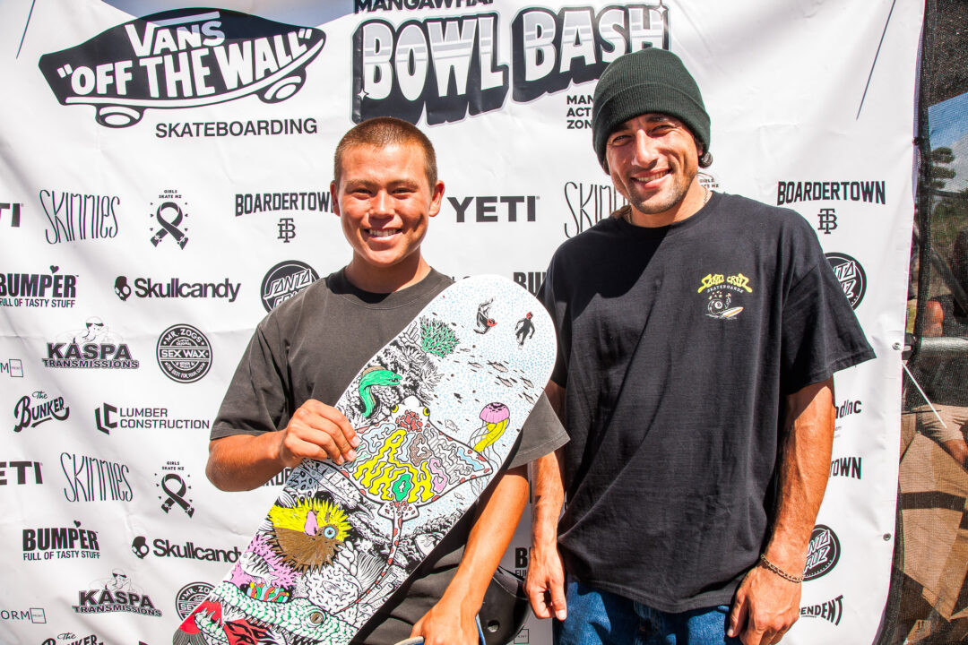 Eric Winkowski presenting Zedyn Fellows with a custom-coloured-in board as a additional prize for winning the best trick on the Yeti cooler — Cab’ boneless.